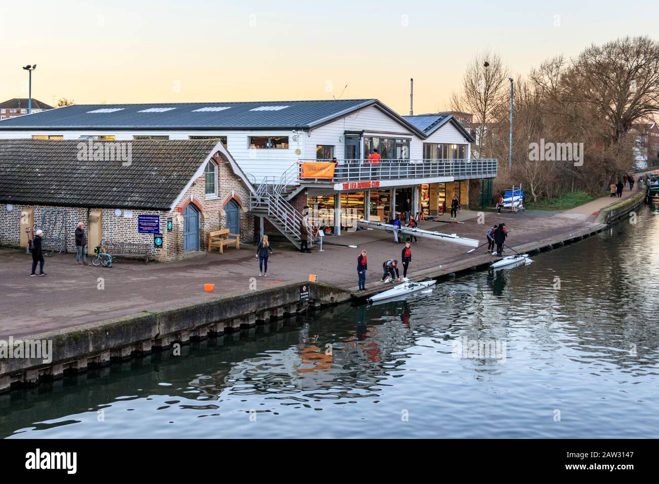 Rowers returning with their boats to the Lea Rowing Club on a Sunday