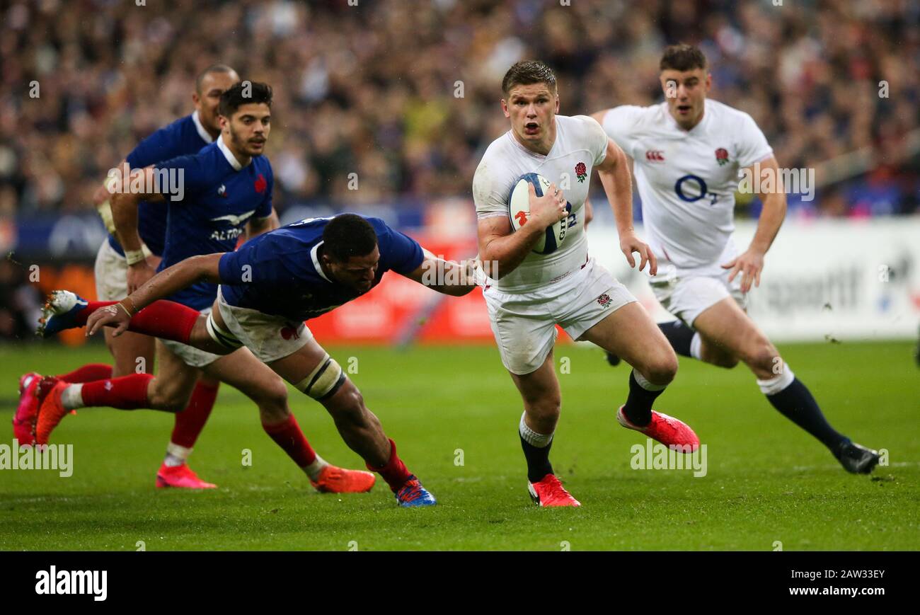 Owen Farrell of England makes a run to the line but is held back by ...