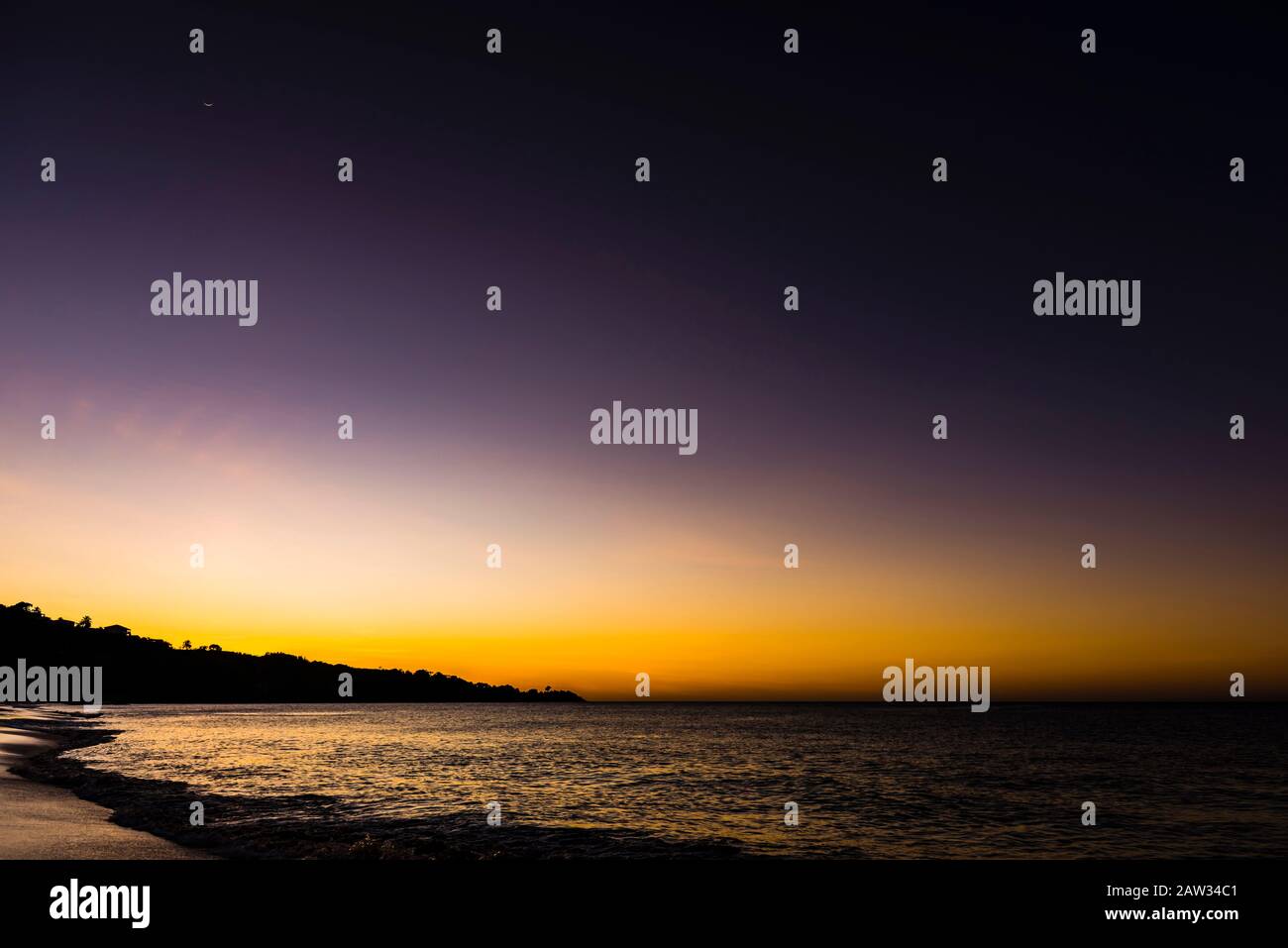 Crescent moon at sunset over Grand Anse Beach, St Grenada