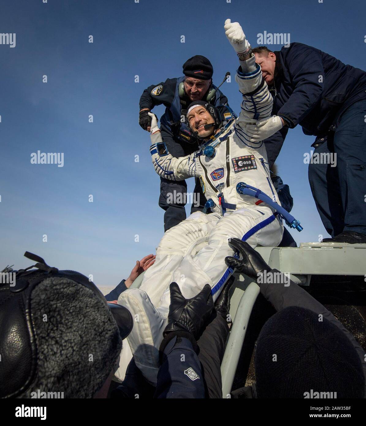ESA astronaut Luca Parmitano is helped out of the Soyuz MS-13 spacecraft just minutes after he, NASA astronaut Christina Koch, and Roscosmos cosmonaut Alexander Skvortsov, landed their Soyuz MS-13 capsule in a remote area near the town of Zhezkazgan, Kazakhstan on Thursday, Feb. 6, 2020. Koch returned to Earth after logging 328 days in space --- the longest spaceflight in history by a woman --- as a member of Expeditions 59-60-61 on the International Space Station. Skvortsov and Parmitano returned after 201 days in space where they served as Expedition 60-61 crew members onboard the station. P Stock Photo