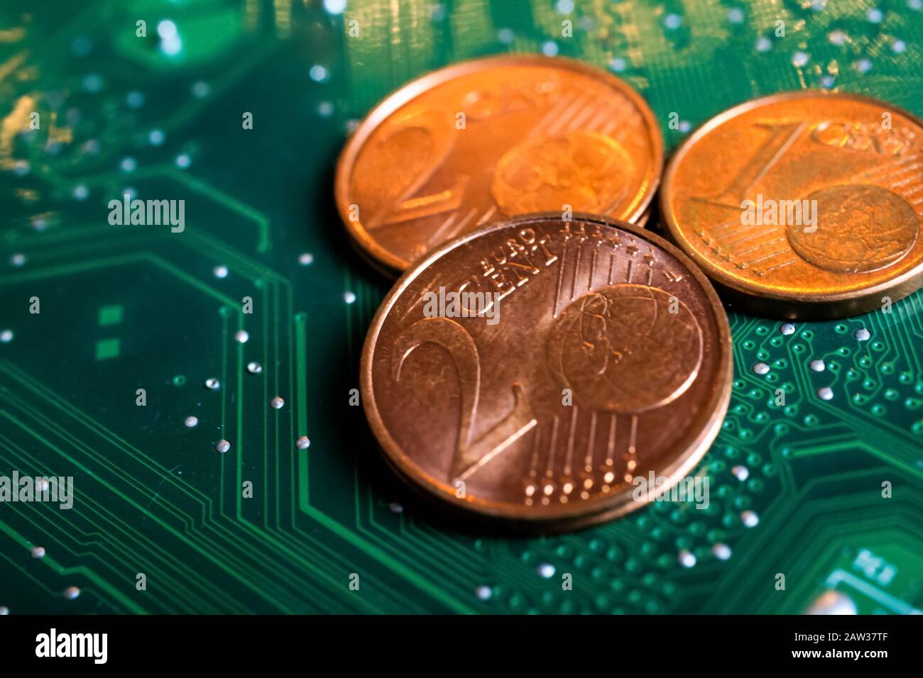 Makro close up of isolated glowing blurred pile euro cent coins on green motherboard Stock Photo