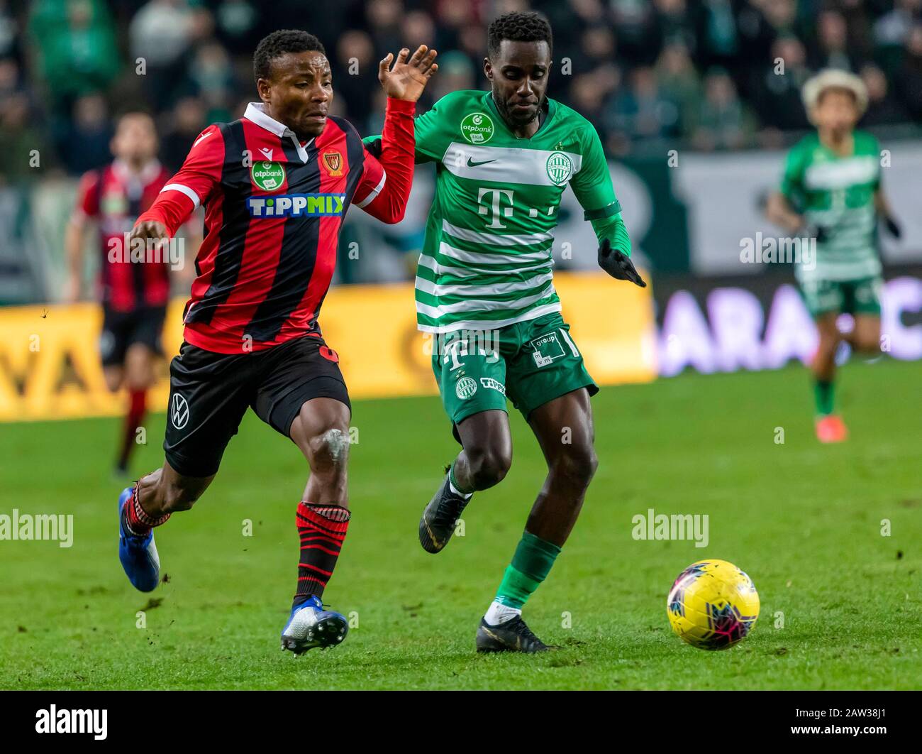 BUDAPEST, HUNGARY - AUGUST 29: (l-r) Tokmac Chol Nguen of Ferencvarosi TC  celebrates his goal in front of Gergo Lovrencsics of Ferencvarosi TC during  the UEFA Europa League Play-off Second Leg match