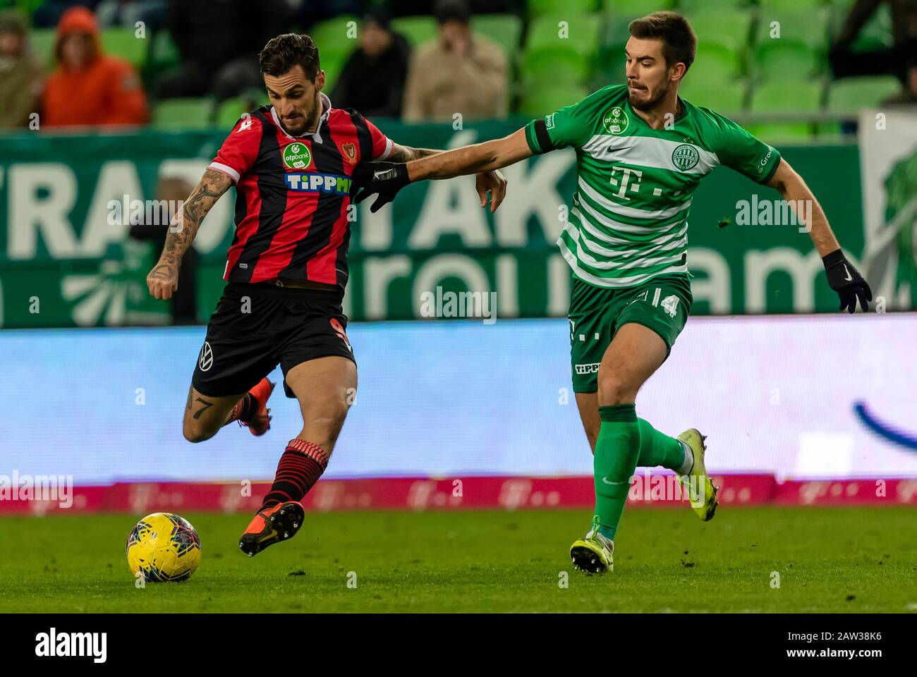 BUDAPEST, HUNGARY - FEBRUARY 5: (l-r) Davide Lanzafame of Budapest Honved shoots on goal next to Ihor Kharatin of Ferencvarosi TC during the Hungarian OTP Bank Liga match between Ferencvarosi TC and Budapest Honved at Groupama Arena on February 5, 2020 in Budapest, Hungary. Stock Photo