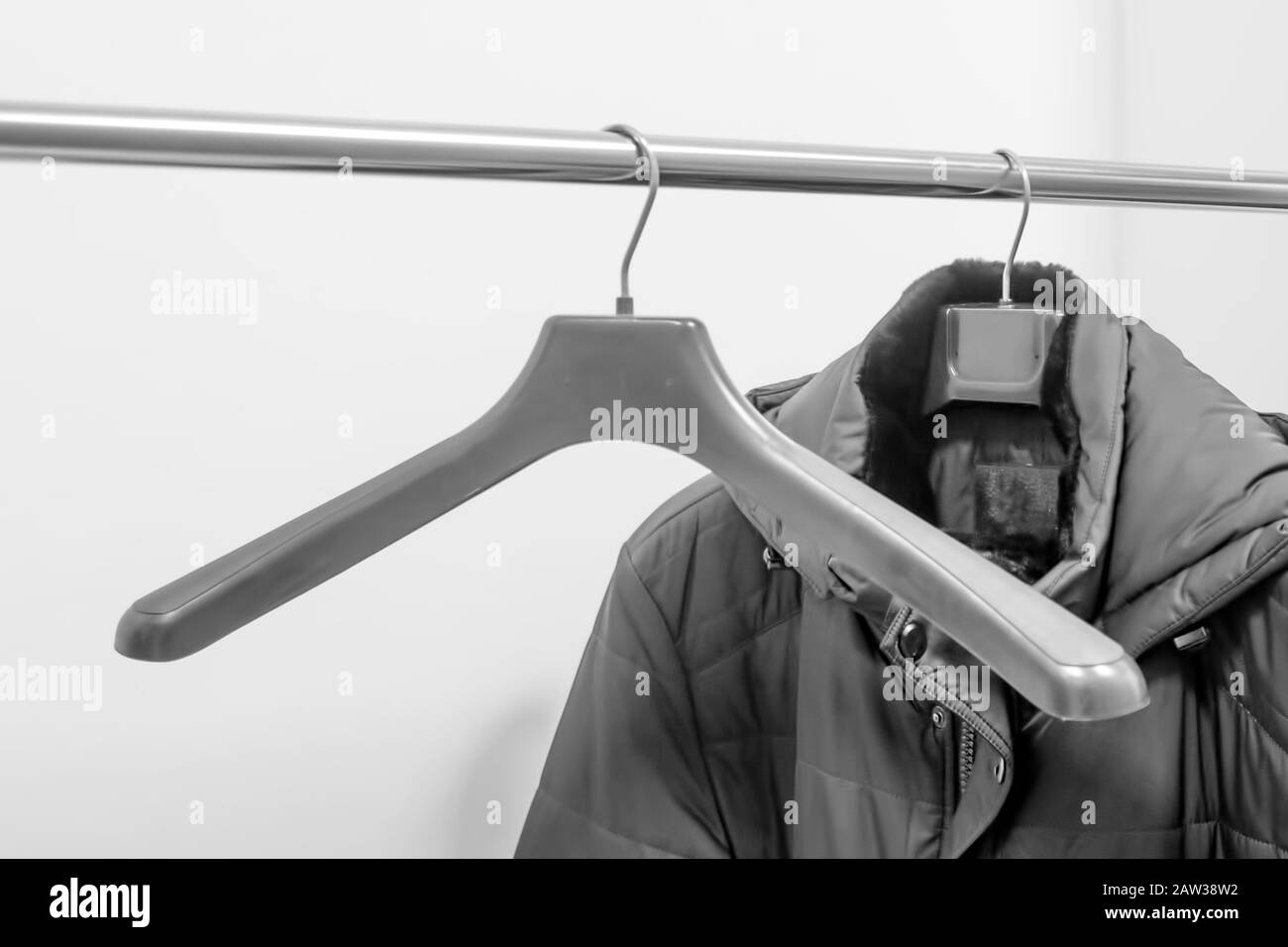 Coat hanging Black and White Stock Photos & Images Alamy