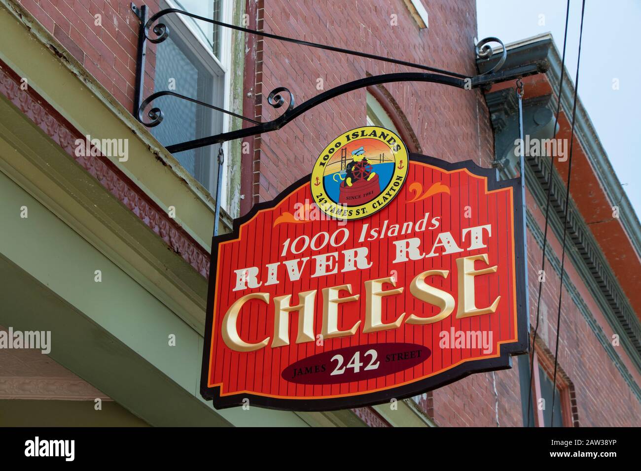 July 26, 2019 -  Town of Clayton, NY, USA : Iron Wooden Signboard of 1000 Islands River Hat Cheese Front Facade Store, Downtown Stock Photo
