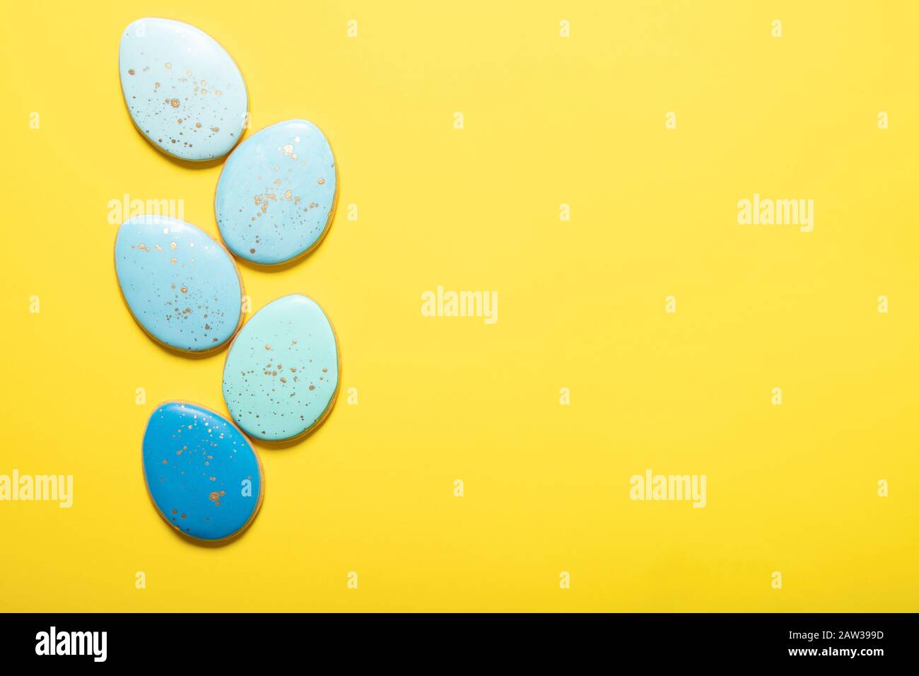 Easter cookies on a yellow background. Place for text. Easter eggs. Stock Photo
