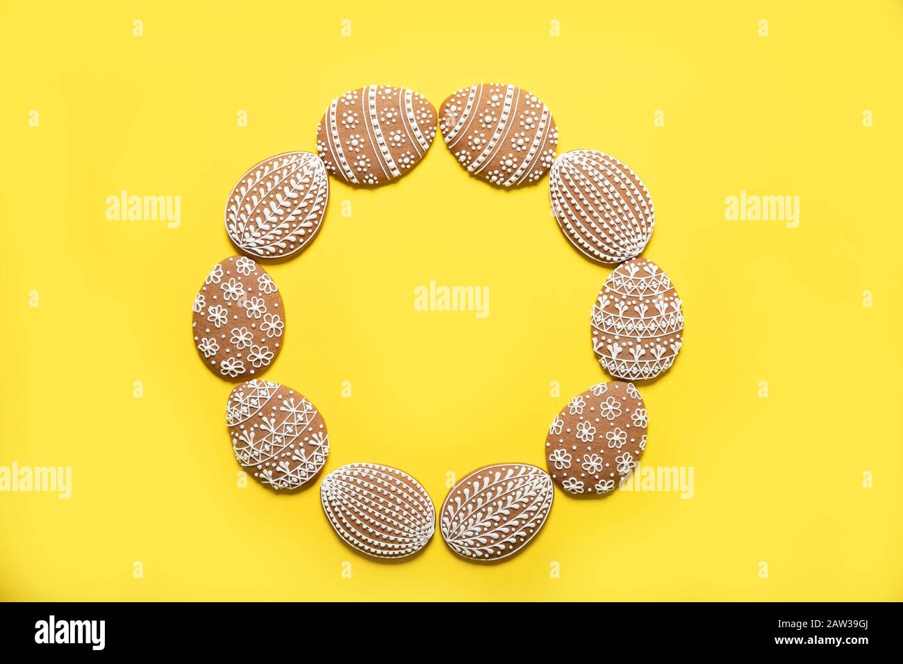 Easter cookies on a yellow background. Easter eggs. Top view. Stock Photo