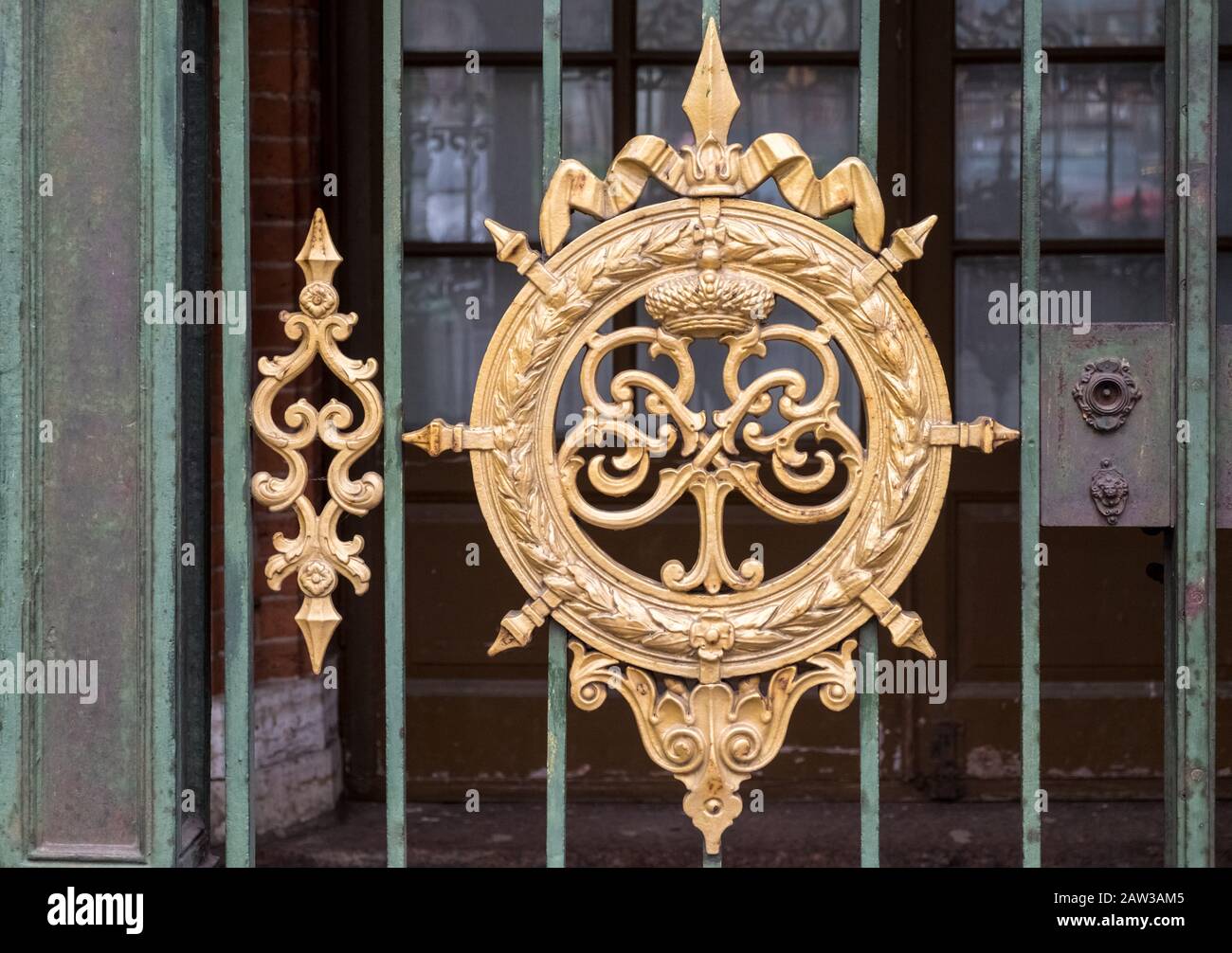 Entrance gate and gilded monogram to Cabin of Peter the Great, a small wooden house and the first 'palace' of Saint Petersburg, Russia Stock Photo