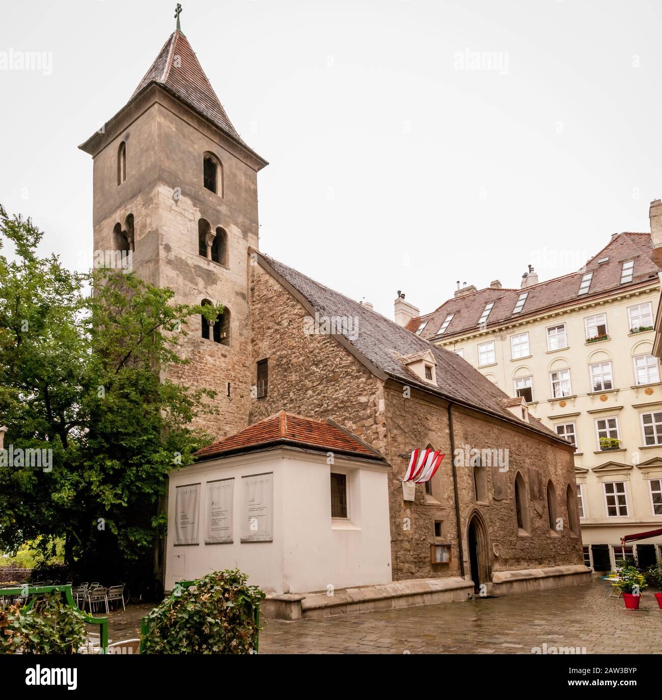 The medieval Ruprechtskirche (St. Rupert's Church) with old tree on the small yard is one of the oldest churches in Vienna, located on Ruprechtsplatz Stock Photo