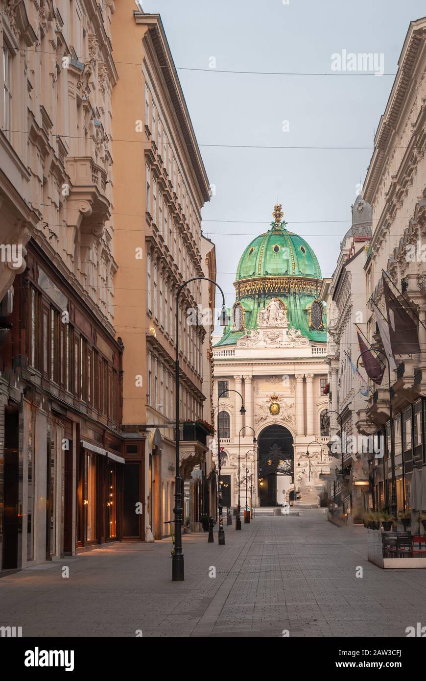 Kohlmarkt street with Hofburg Complex in early morning in downtown of Vienna in Austria with none in the street Stock Photo