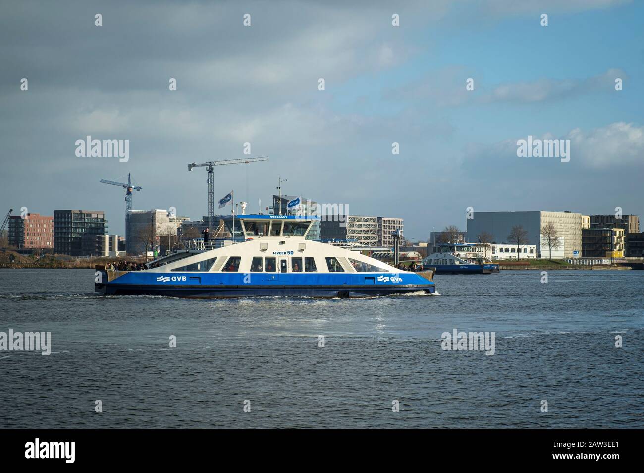 Ferries carrying passengers between Amsterdam and Amsterdam Noord (North). Stock Photo