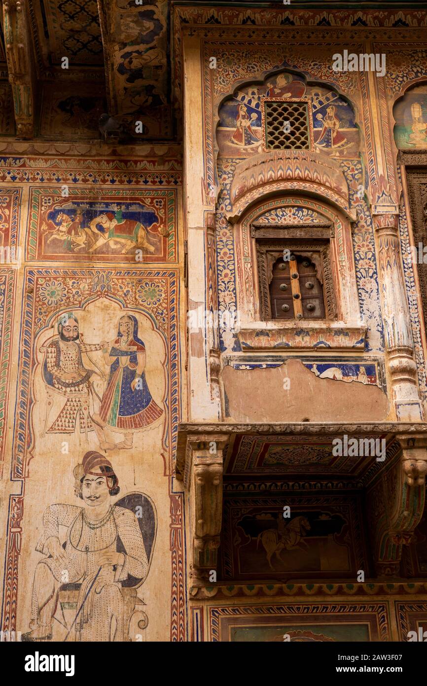 India, Rajasthan, Shekhawati, Mandawa, decorated haveli, jettied upper floor with wooden window shutters of decorated haveli being restored as heritag Stock Photo
