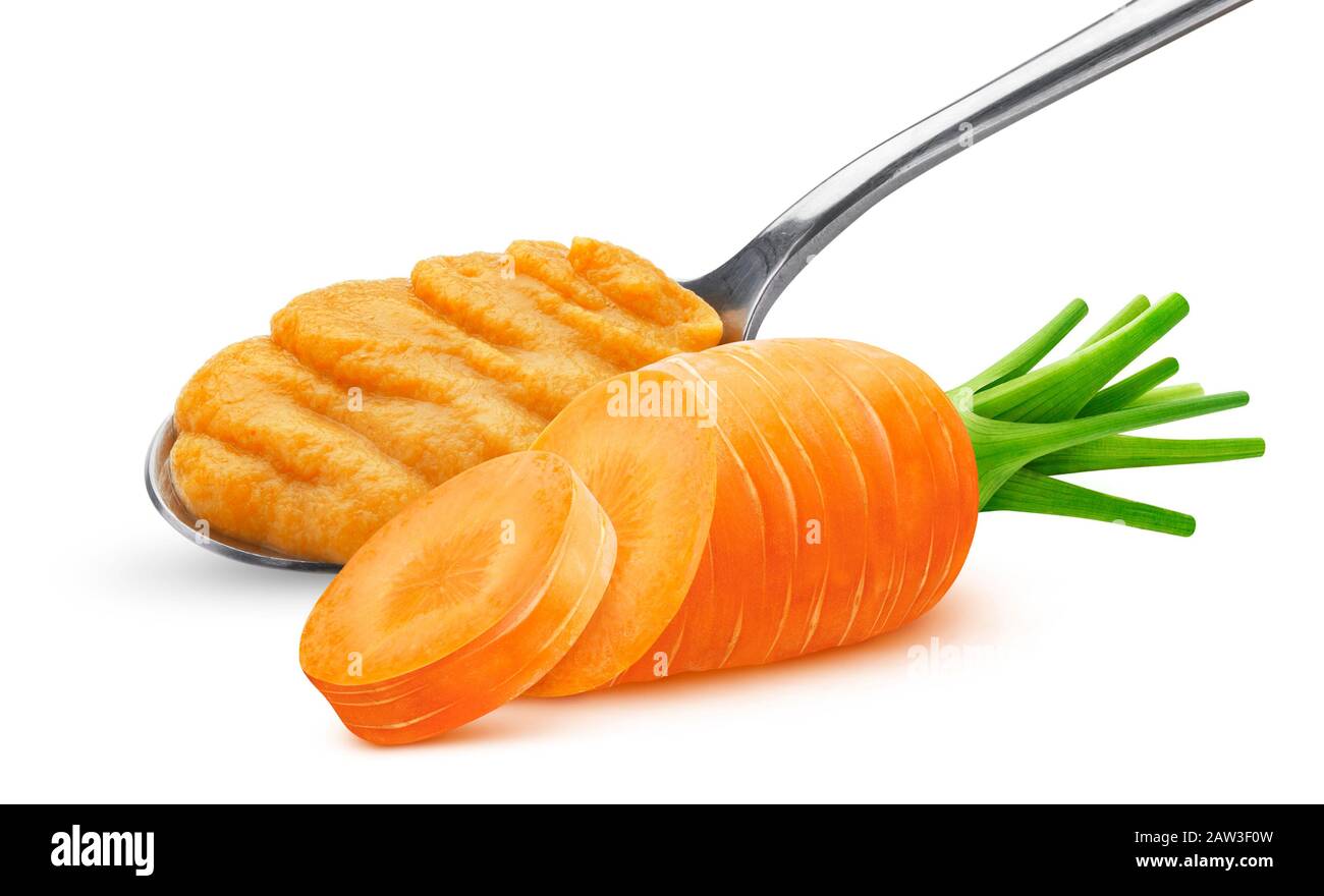 Carrot puree in spoon isolated on white background Stock Photo