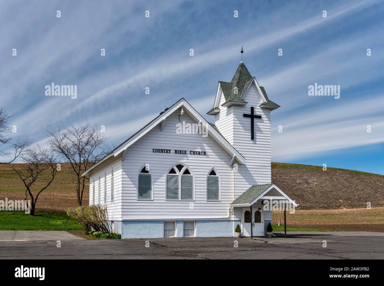 Cirrostratus aka billow clouds over Country Bible Church in The Palouse countryside near community of Dusty, Washington, USA Stock Photo