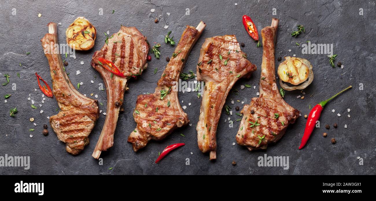 Grilled lamb ribs. Hot rack of lamb with spices and condiments. Top