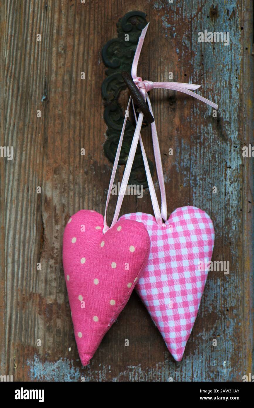 Two hearts on old wooden background Stock Photo