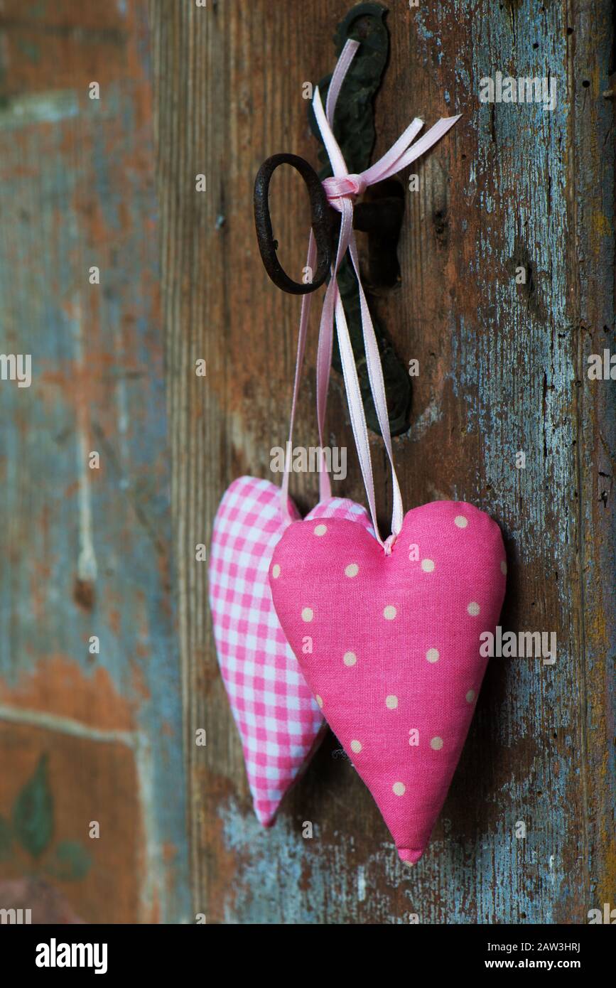 Two hearts on old wooden background Stock Photo