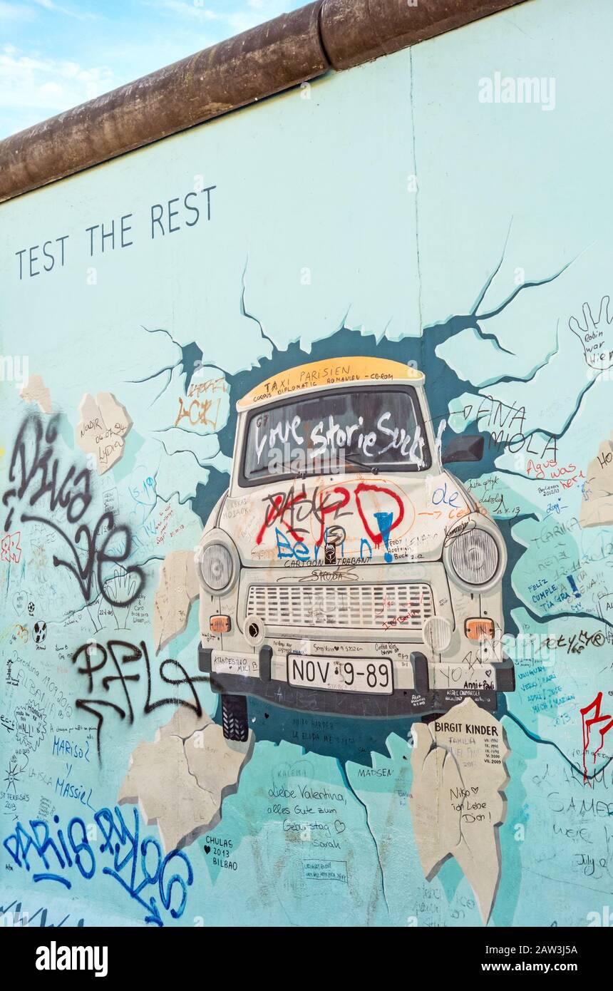 Berlin, Germany - October 26, 2013: the murial titled 'Test the Rest' by Birgit Kinder on a remnant of the Berlin Wall, East Side Gallery, Berlin. Stock Photo