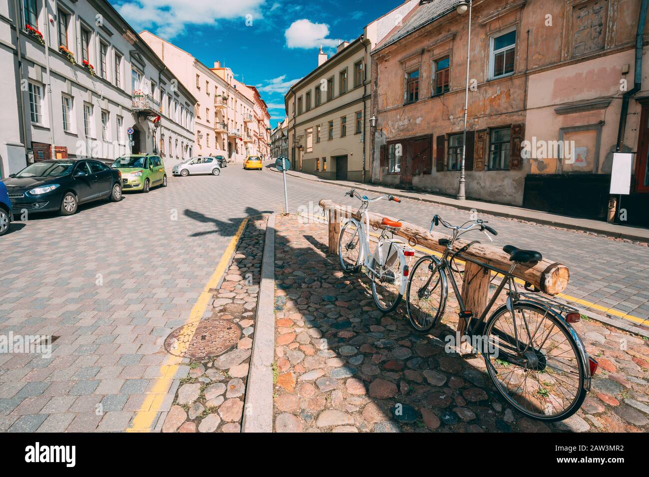 Vilnius, Lithuania. Architecture Of Uzupis Located In Old Town Of Vilnius. District Of Vilniaus Senamiestis. Bicycles Parking In Street. Stock Photo