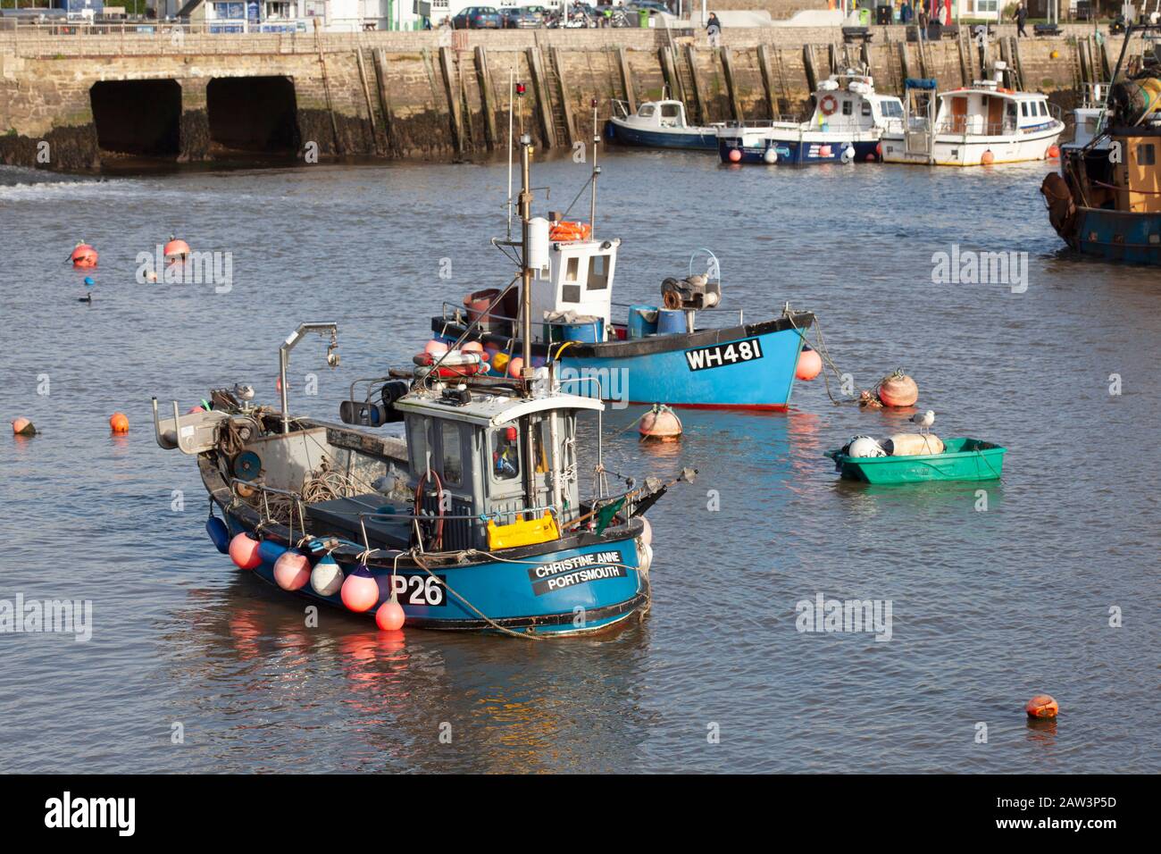 Fishing boats in the harbour at West Bay, Dorset Stock Photo - Alamy