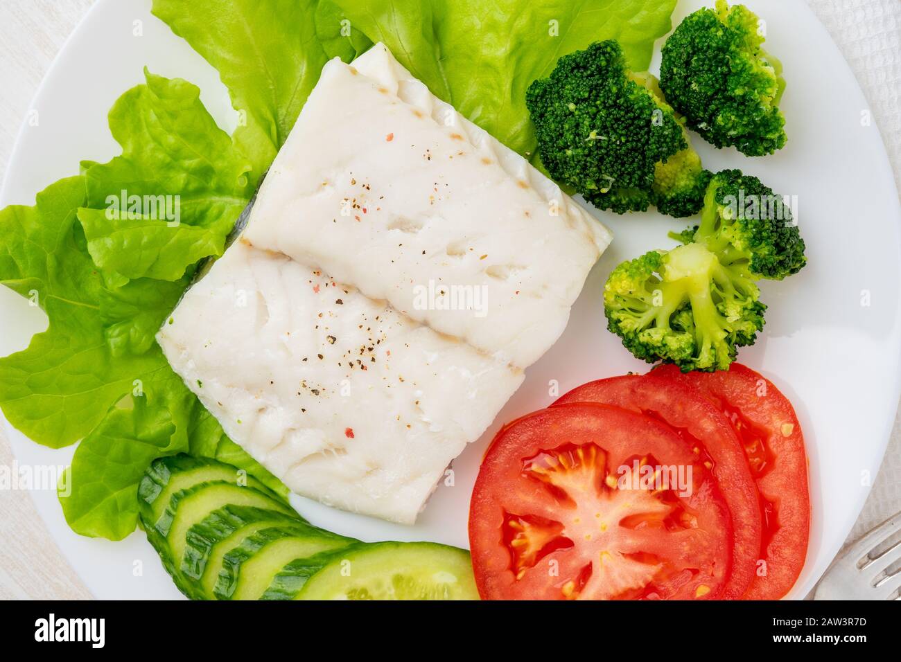 Steamed cod fish. Paleo, keto, fodmap healthy diet with vegetables on