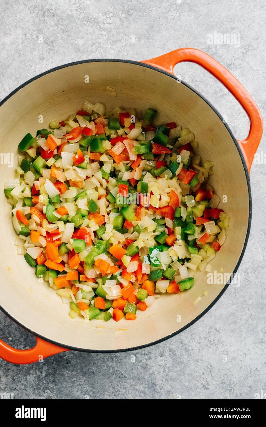 Diced peppers and onion sauteed in a Dutch oven Stock Photo Alamy
