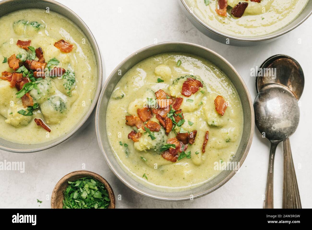 Potato and broccoli soup with bacon table setting Stock Photo