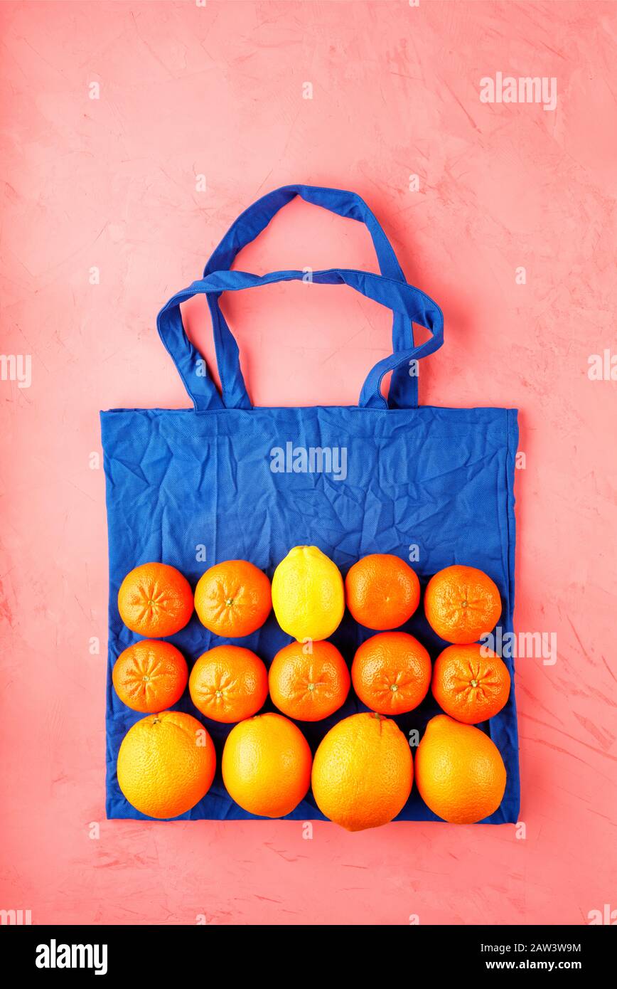 Zero waste food shopping, eco natural bag classic blue color with fruits and vegetables. Stock Photo