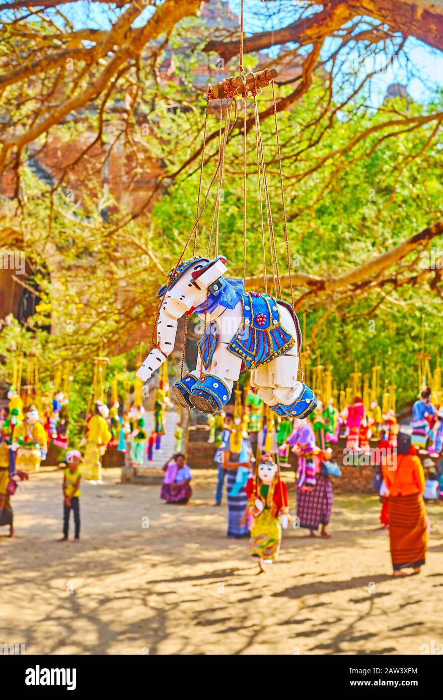 The colorful wooden string puppet in shape of elephant in outdoor stall of Dhammayangyi Temple market, Bagan, Myanmar Stock Photo