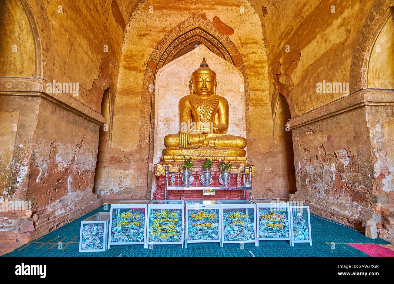 BAGAN, MYANMAR - FEBRUARY 25, 2018:  The ancient interior of Dhammayangyi Pagoda with golden Image of Buddha in Earth the Witness (Touching Earth) ges Stock Photo