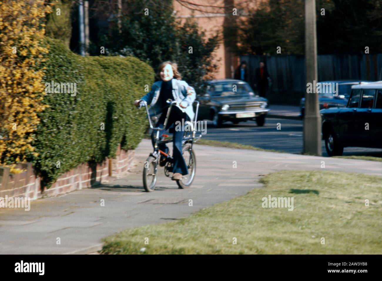 An 11 year old boy riding his new Raleigh Chopper American export bike in 1973 in the suburbs of London UK. Stock Photo