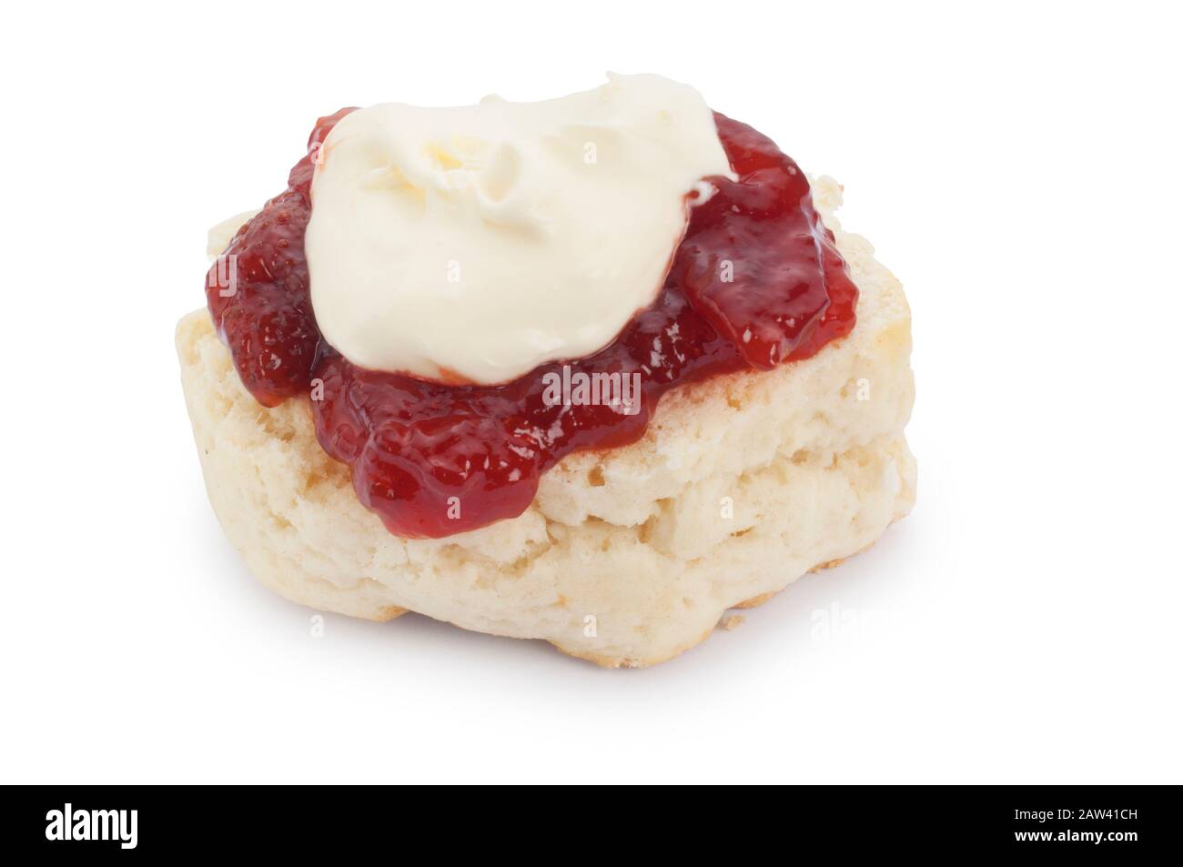Studio shot of homemade scones, clotted cream and strawberry jam. When the cream is on top it said that it is a Cornish version - John Gollop Stock Photo