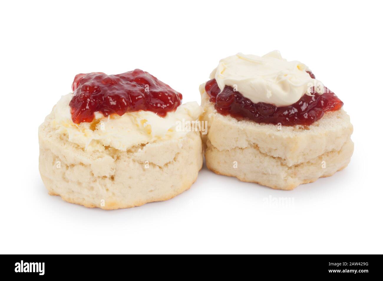 Studio shot of scones, cream and strawberry jam. When the jam is on top it said that it is a Devonshire version, cream, Cornish version - John Gollop Stock Photo