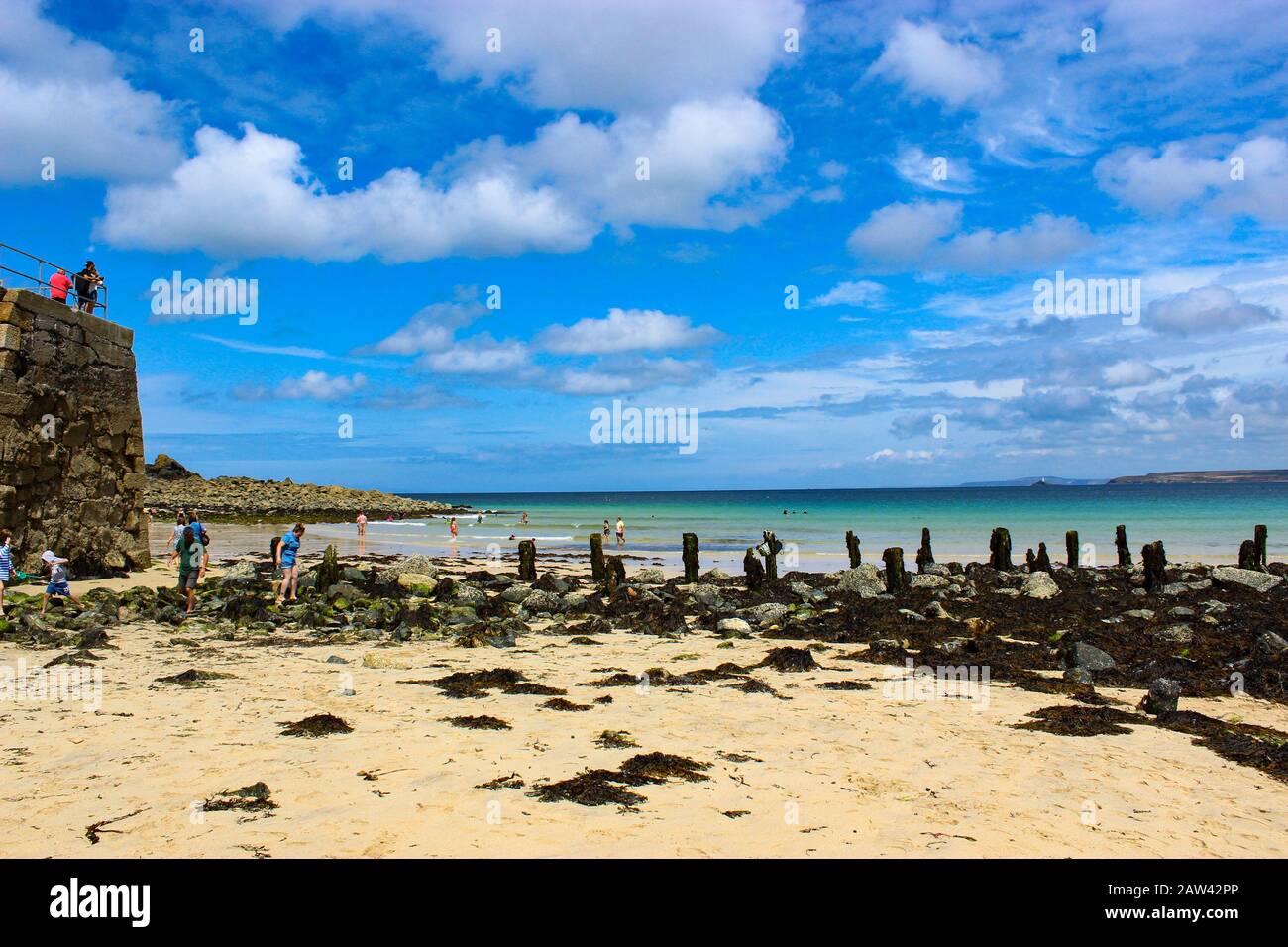 A beautiful tropical looking beach in Carbis bay, Cornwall England on a hot sunny summers day Stock Photo