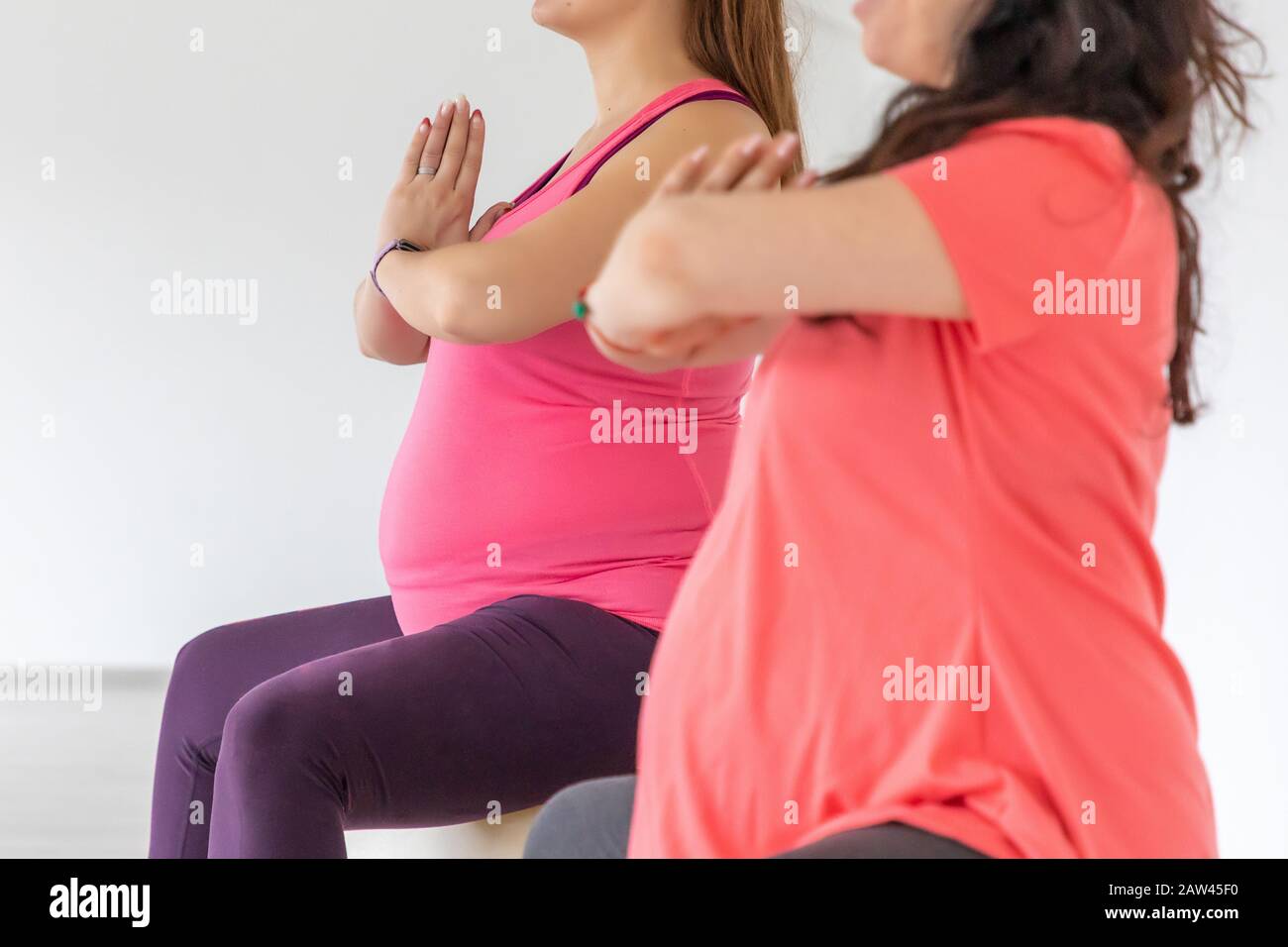 Pregnant women are doing yoga and maditition in yoga class, Healthy prenatal lifestyle Stock Photo