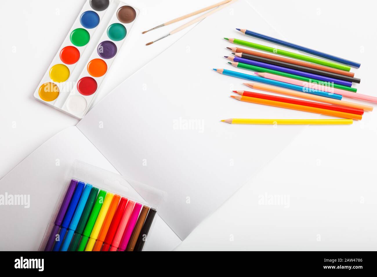 Closeup color drawing supplies, colorful crayon pencils assortment on white  background with copy space. For banner, design. Top view. by Manee S. Photo  stock - StudioNow