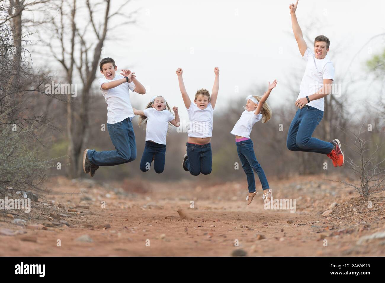 Kids jumping for joy Stock Photo