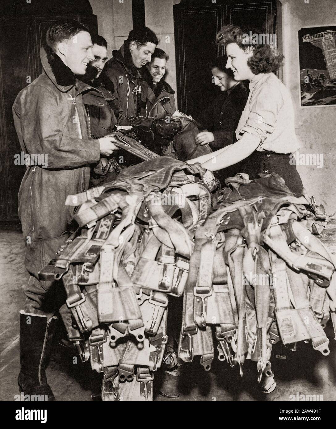 Parachute packers of the WAAF with air crew. The WAAF (Women's Auxiliary Air Force) was created on 28 June 1939,  and women recruited into the WAAF were given basic training. WAAFs did not serve as aircrew, but were active in parachute packing and the crewing of barrage balloons in addition to performing catering, meteorology, radar, aircraft maintenance, transport, communications duties including wireless telephonic and telegraphic operation. Stock Photo