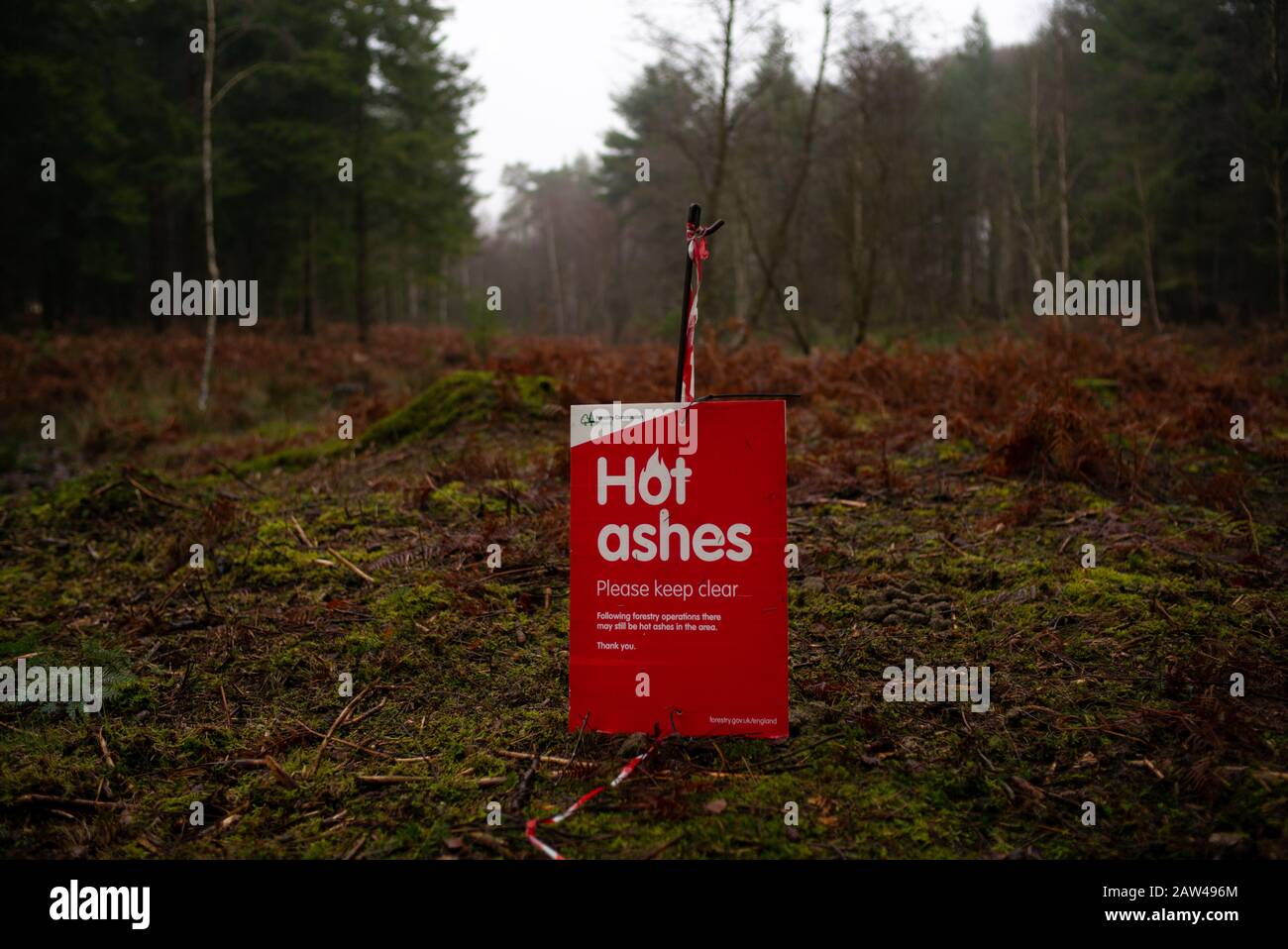 A warning Hot ashes sign in the New Forest Hampshire England due to forest management burning of