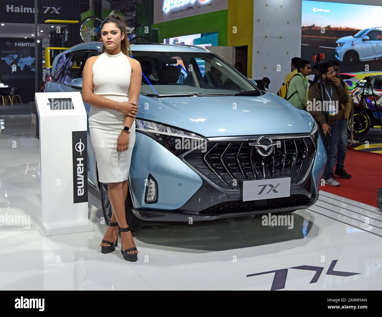 Noida, Delhi, India. 6th Feb, 2020. A model poses next to a Haima 7X displayed at the Auto Expo 2020 in Greater Noida Credit: Ganesh Chandra/SOPA Images/ZUMA Wire/Alamy Live News Stock Photo
