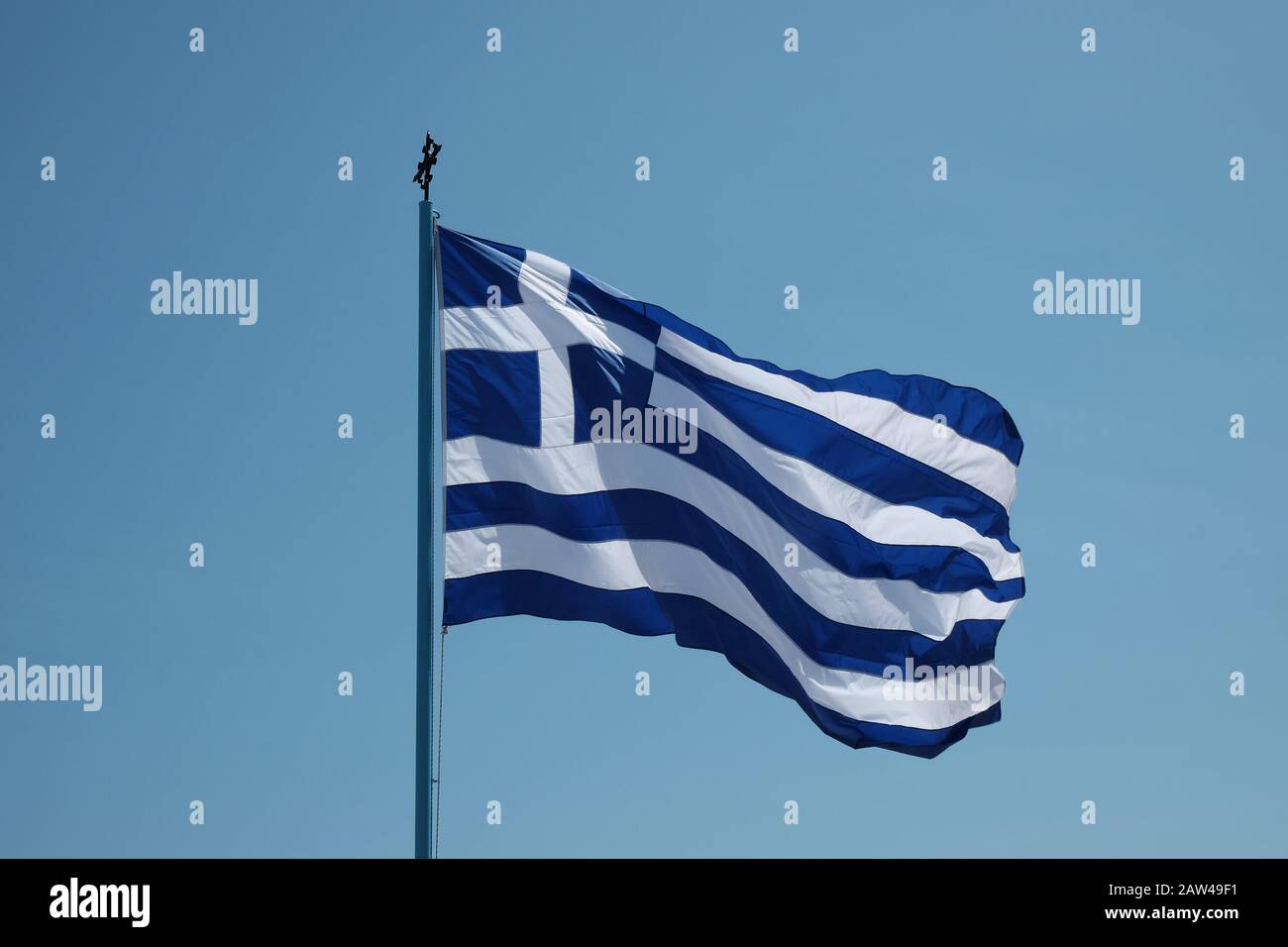 The flag of Greece flying on the island of Zakynthos near St Dionysios Church. Stock Photo