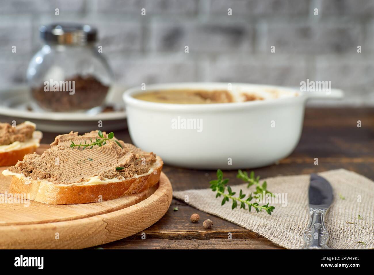 Toast with chicken liver pate on wooden table. Recipe concept Stock