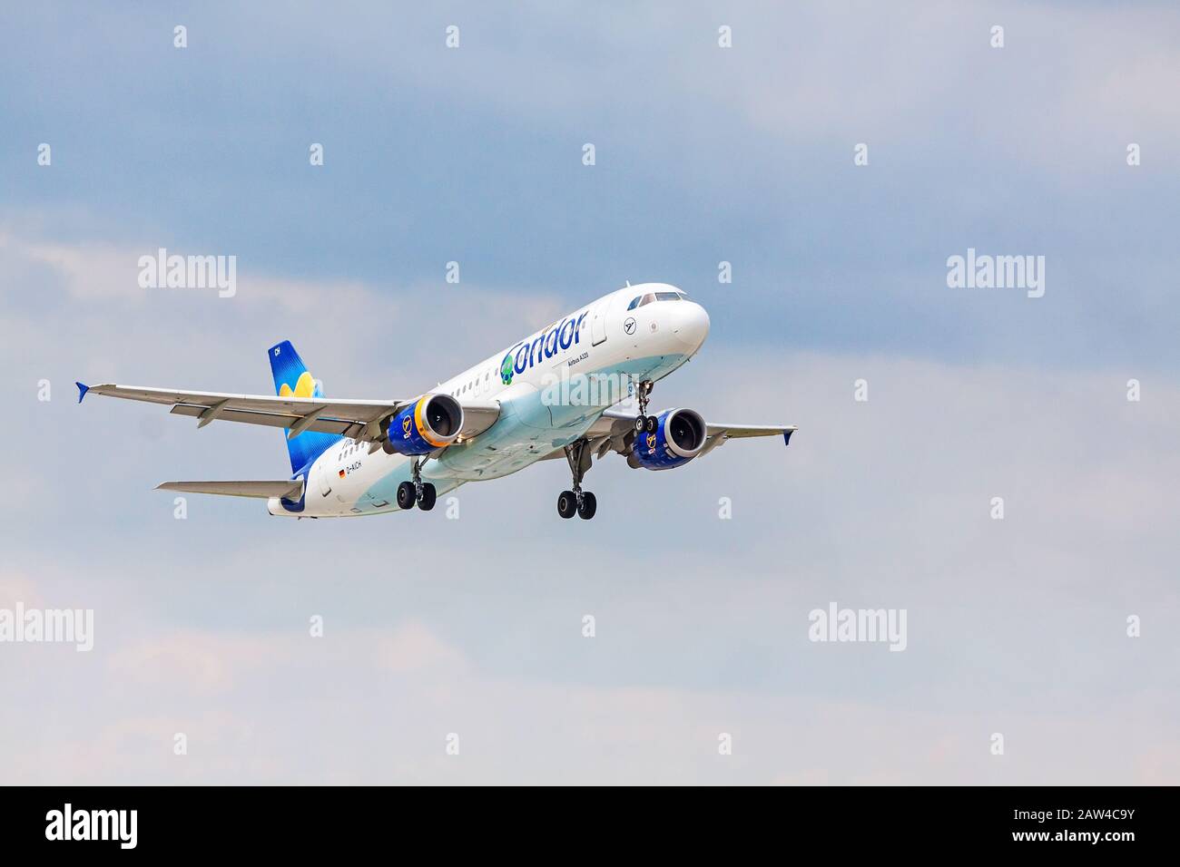 Stuttgart, Germany - April 29, 2017: Airbus airplane A320 from Condor after takeoff from runway - airport Stuttgart, blue sky with clouds in backgroun Stock Photo
