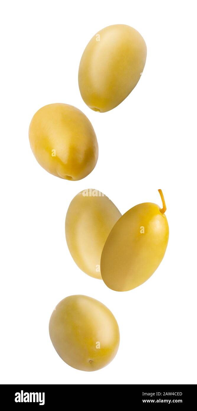 Falling green pickled olives isolated on white background. Stock Photo