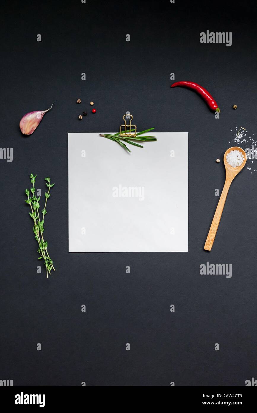 Flat Lay Overhead View Blank Recipe Paper Page With Clip Mockup Text Space Invitation Card On Black Background With Greens Herbs And Spices Menu Reci Stock Photo Alamy