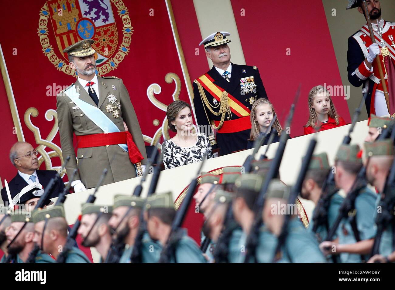 (L-R) King Felipe VI of Spain, Queen Letizia of Spain, Princess Leonor of Spain and Princess Sofia of Spain attend the National Day military parade. O Stock Photo