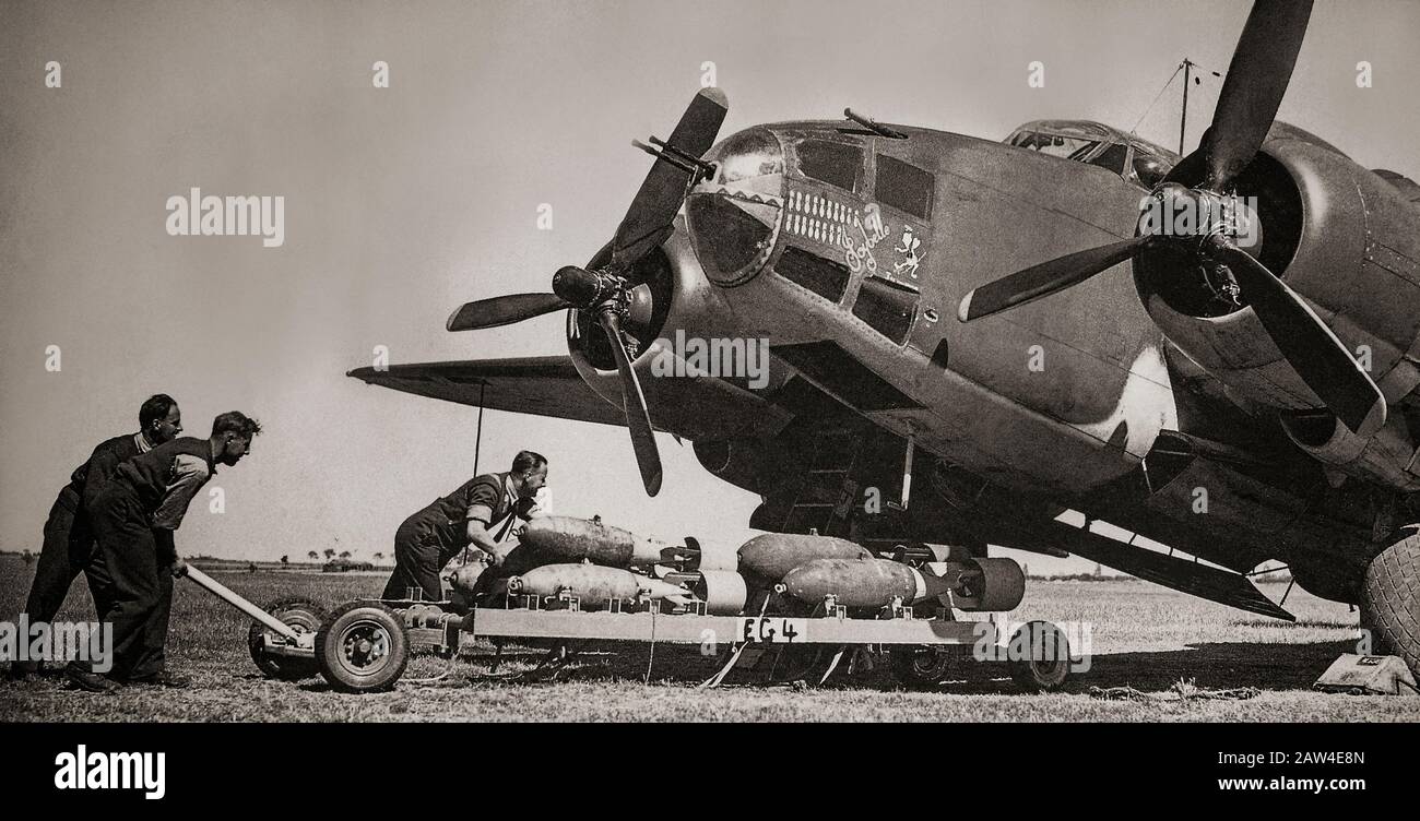 RAF ground crew transporting 250 pound general purpose, and 500 pound medium capacity bombs to a Lockheed Ventura, a US built twin engine patrol bomber. They were in use with three Royal Air Force (RAF) squadrons in 1942, but never very popular among RAF crews. Although it was 50 mph (80 km/h) faster and carried more than twice as many bombs as its predecessor, the Hudson, it proved unsatisfactory as a bomber. Stock Photo