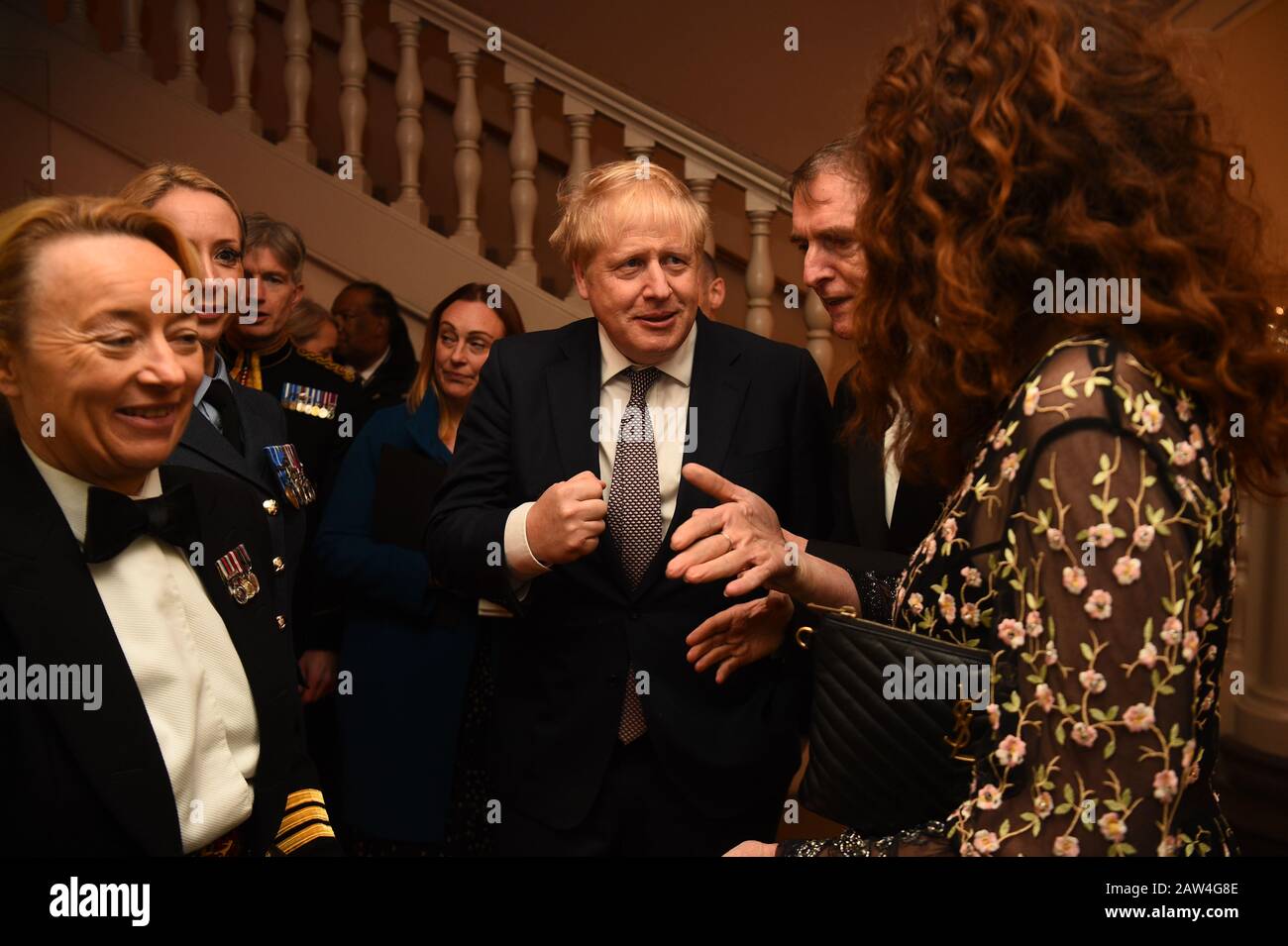 Rebekah Brooks (right) Chief Executive of News UK and Tony Gallagher Editor in Chief, The Sun (second right) with Prime Minister Boris Johnson as he arrives for The Sun Military Awards 2020 held at the Banqueting House, London. PA Photo. Picture date: Thursday February 6, 2020. Photo credit should read: Kirsty O'Connor/PA Wire Stock Photo
