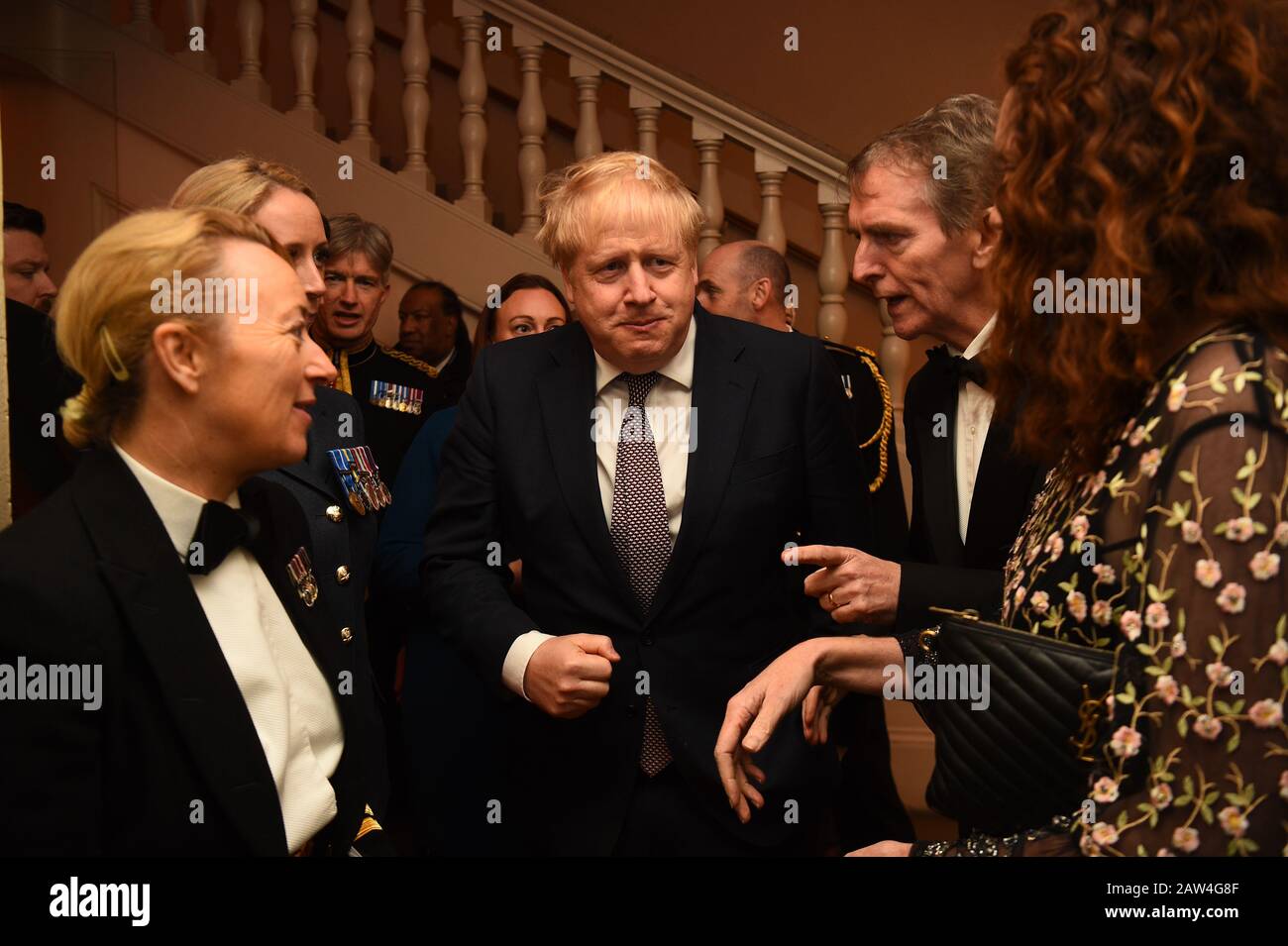 Rebekah Brooks (right) Chief Executive of News UK and Tony Gallagher Editor in Chief, The Sun (second right) with Prime Minister Boris Johnson as he arrives for The Sun Military Awards 2020 held at the Banqueting House, London. PA Photo. Picture date: Thursday February 6, 2020. Photo credit should read: Kirsty O'Connor/PA Wire Stock Photo