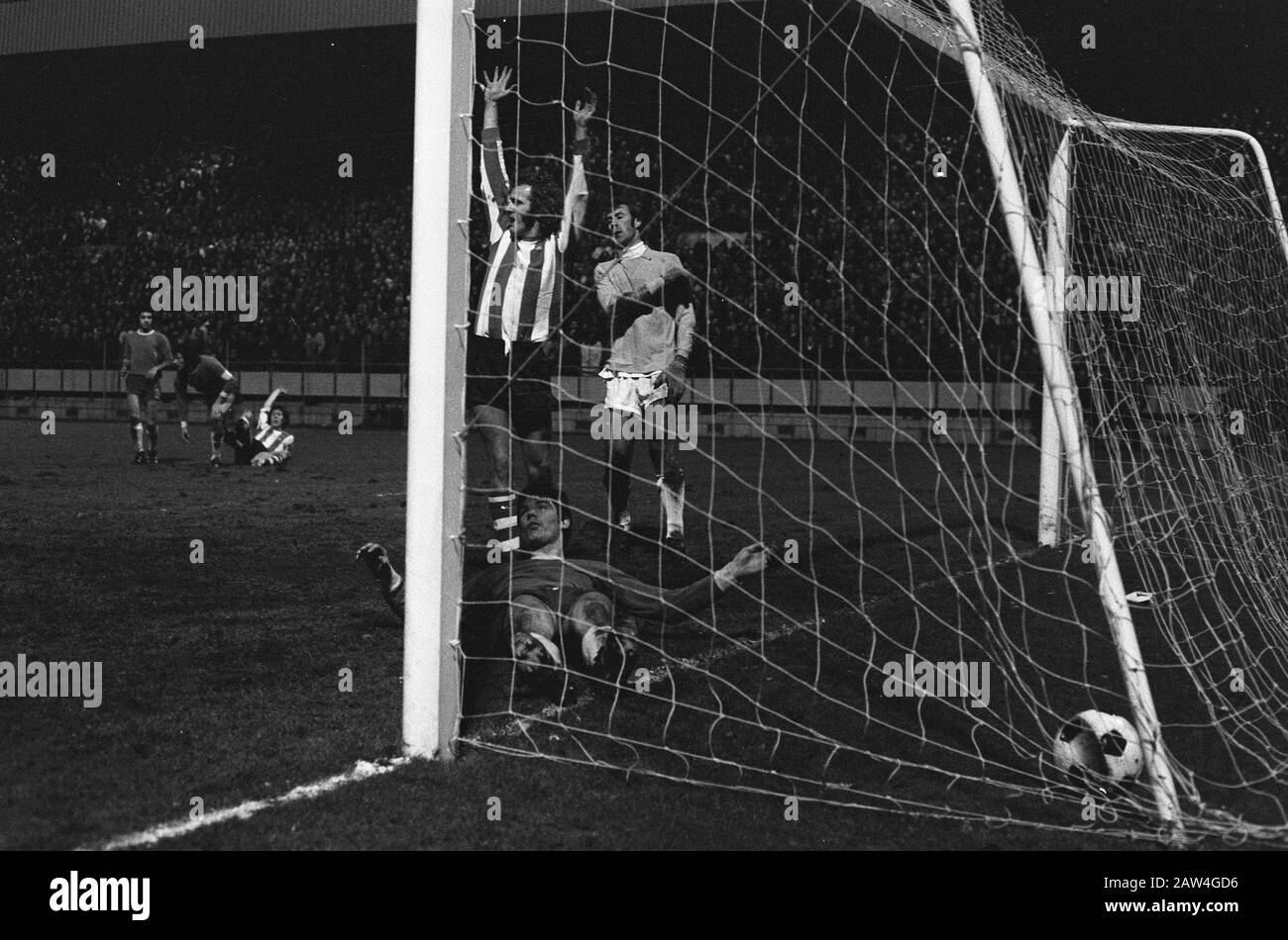 PSV FC Den Haag: 6-0  René van de Kerkhoff cheer, right keeper Thie and lying Korevaar Date: December 8, 1973 Location: Eindhoven, Noord-Brabant Keywords: goals sports, football, soccer Person Name: Graveyard, Willy van der, Korevaar, Joop, Thie, Ton Institution Name: PSV Stock Photo